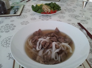 Beef pho - with coriander, basil, chilli, beansprouts and ginger in the middle of the table for everyone to dig in